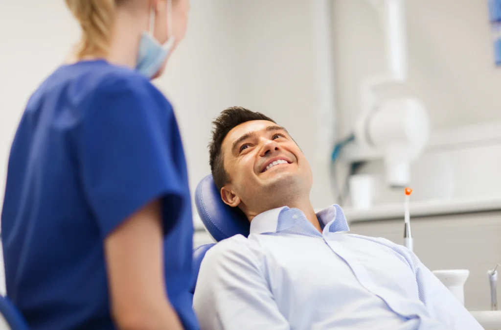 male patient lying in dentist chair